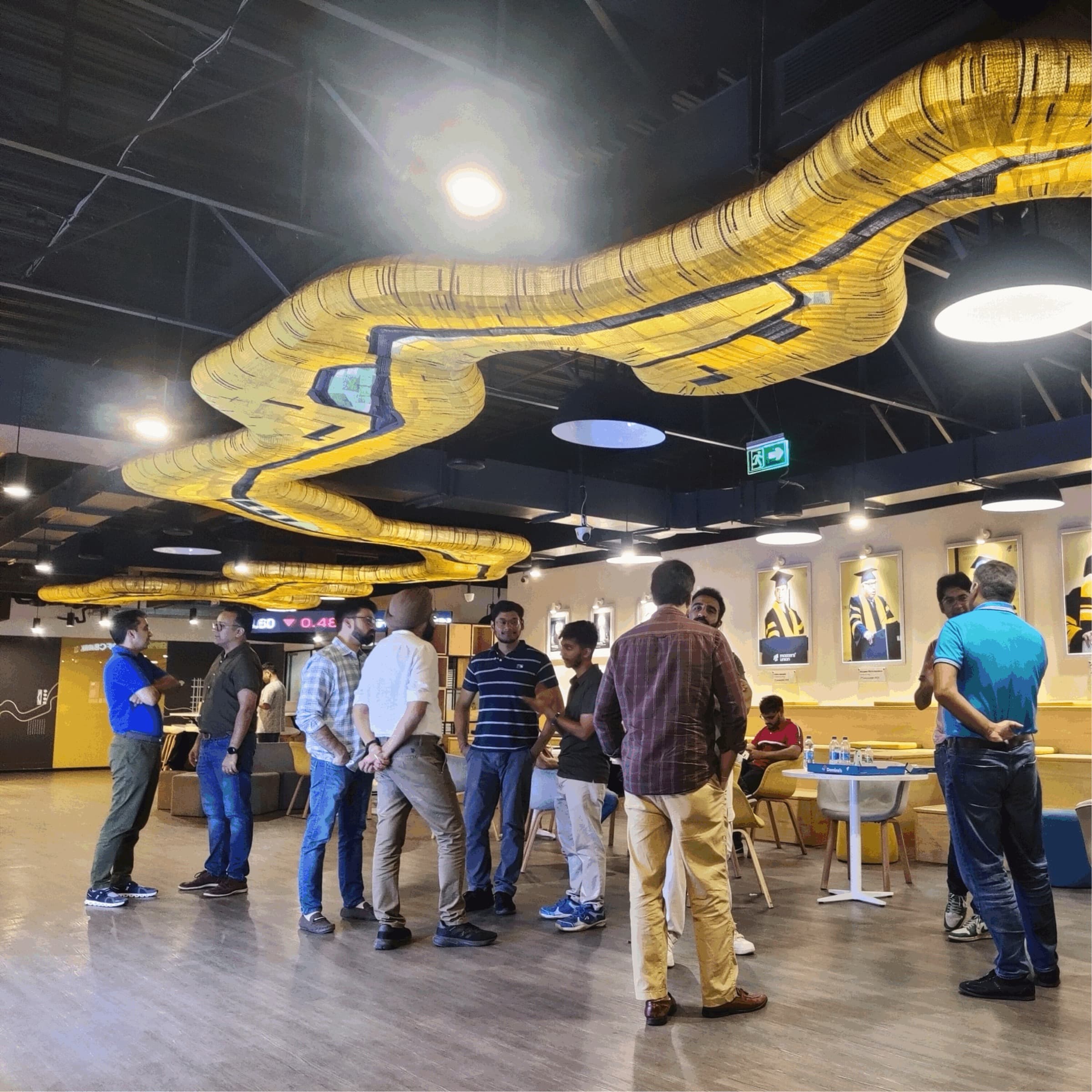 Founders talking in small groups at a TrueAlpha meetup